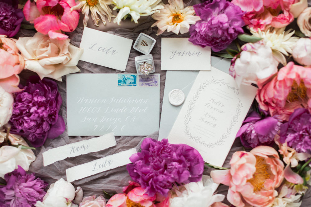 wedding stationary surrounded by florals