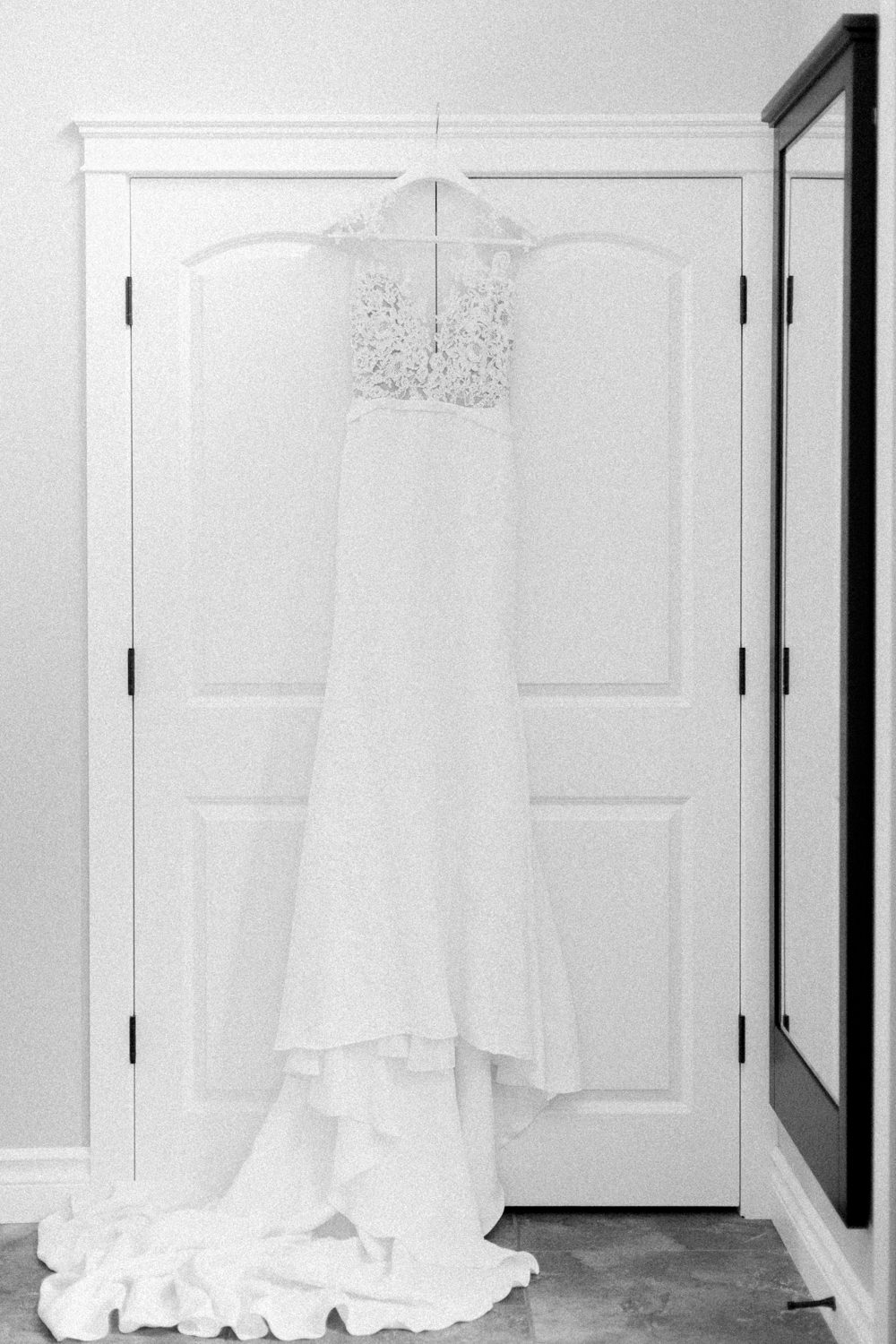 wedding gown hanging on wardrobe at the lake house in Calgary