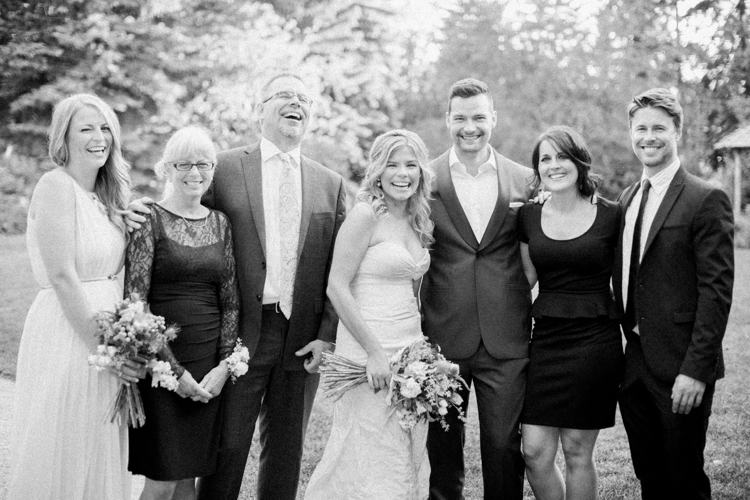 Wedding family photo with family laughing at reader rock garden wedding in Calgary