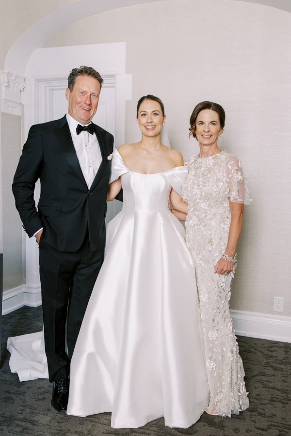 portrait of mother, father and bride at the Calgary Fairmont Palliser Hotel
