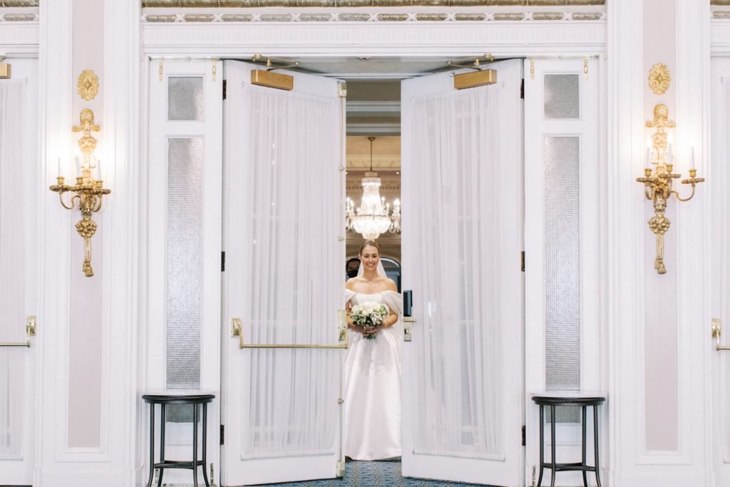 bride entering the ceremony space at the Calgary Fairmont Palliser Hotel