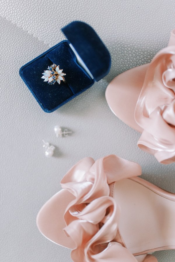 detail photo of wedding shoes and blue ring box at the Calgary Fairmont Palliser Hotel