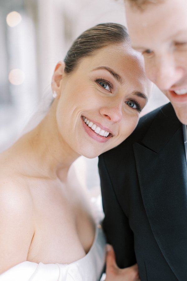 portrait of the bride leaning on grooms shoulder at the Calgary Fairmont Palliser Hotel