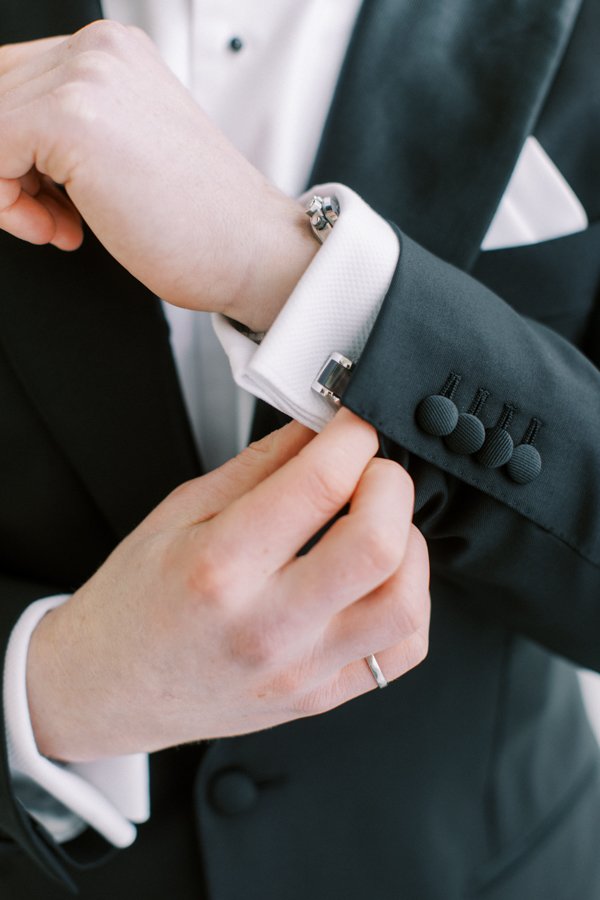 portrait of grooms watch and cuff links at the Calgary Fairmont Palliser Hotel