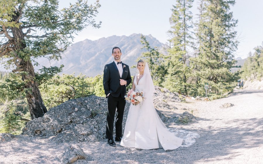 wide shot of bride and groom at surprise corner in Banff Alberta